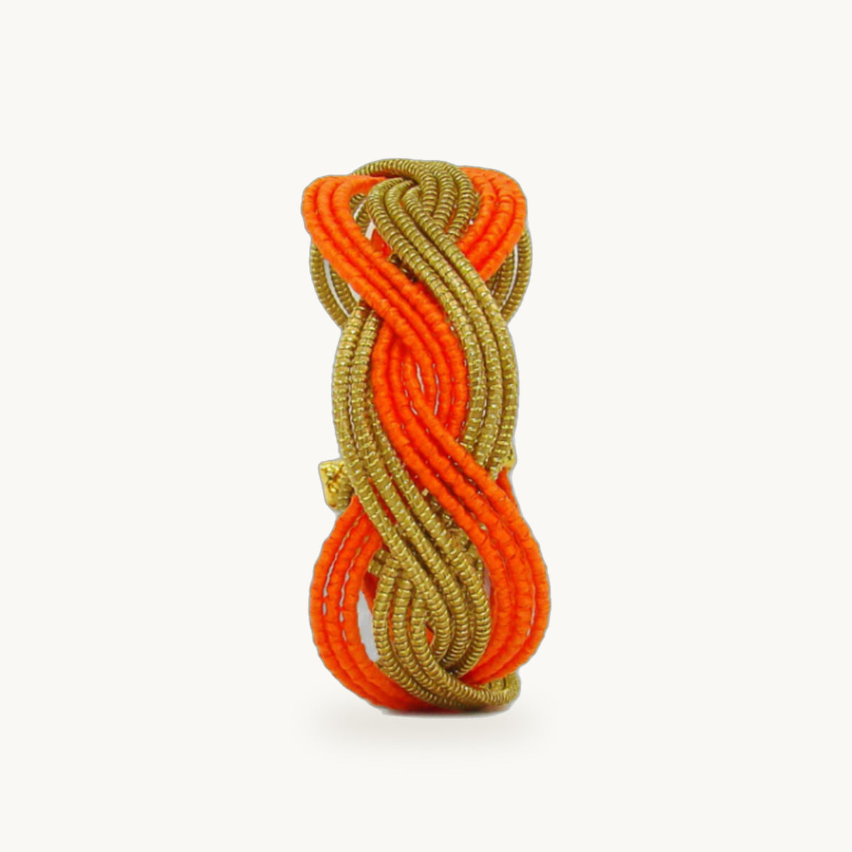 Manchette Caracol ORA bayadère orange, capim dourado tressé main en nœud infini, fond beige